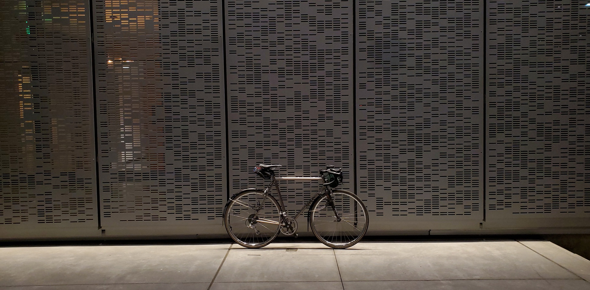 My 1991 Merlin alongside a building facade featuring a random waterjet cut motif